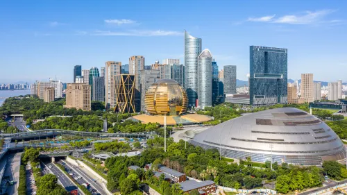 View of Hangzhou skyline, green parks and modern buildings
